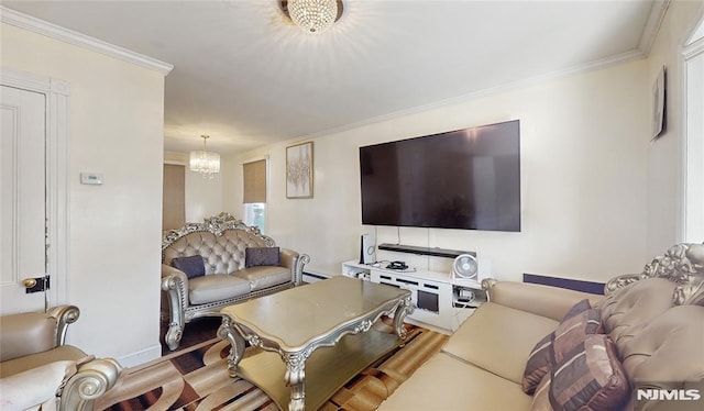 living room featuring an inviting chandelier and ornamental molding