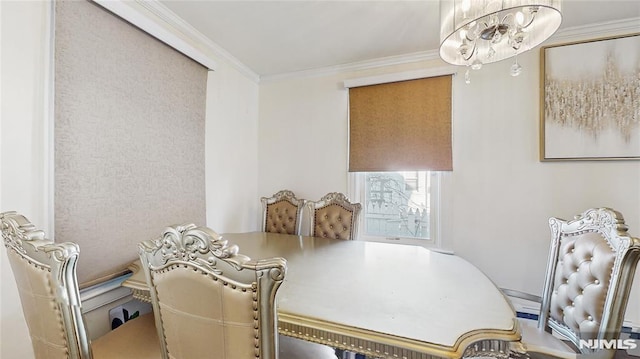 dining area featuring a chandelier and ornamental molding