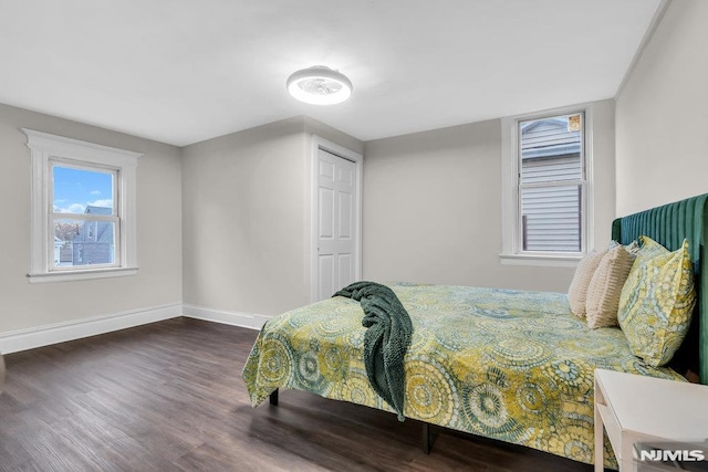 bedroom featuring dark hardwood / wood-style flooring