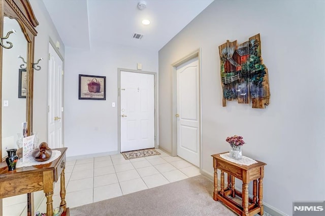 entryway featuring light tile patterned floors