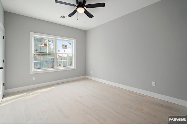 unfurnished room featuring ceiling fan and light hardwood / wood-style floors