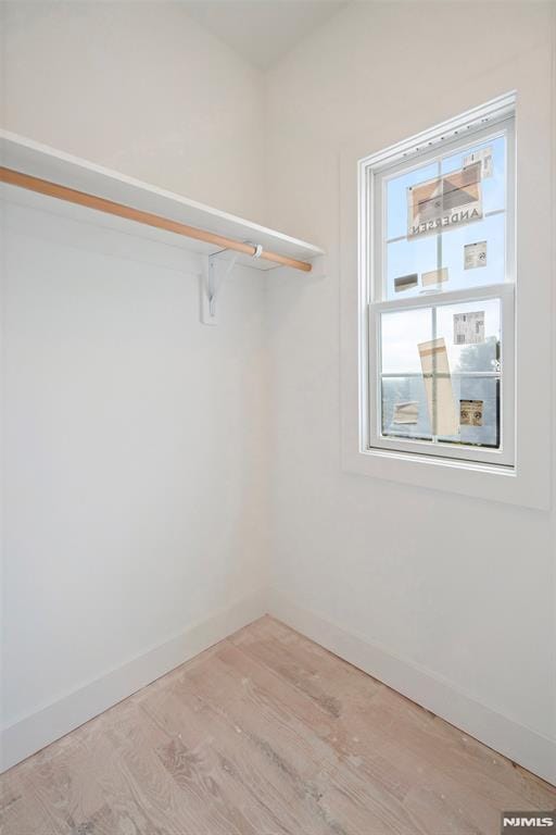 walk in closet featuring light wood-type flooring