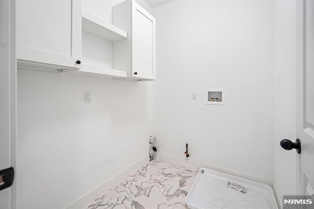 laundry area with hookup for a gas dryer, cabinets, and washer hookup