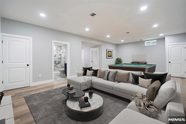 living room featuring hardwood / wood-style floors and pool table