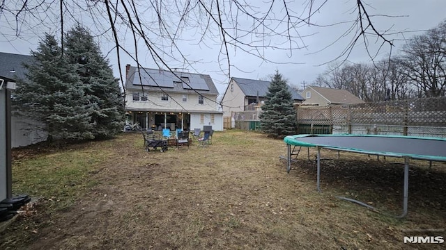 view of yard with a trampoline