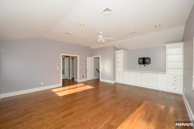 unfurnished living room featuring lofted ceiling, ceiling fan, and wood-type flooring