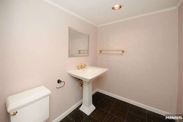 bathroom with toilet and crown molding