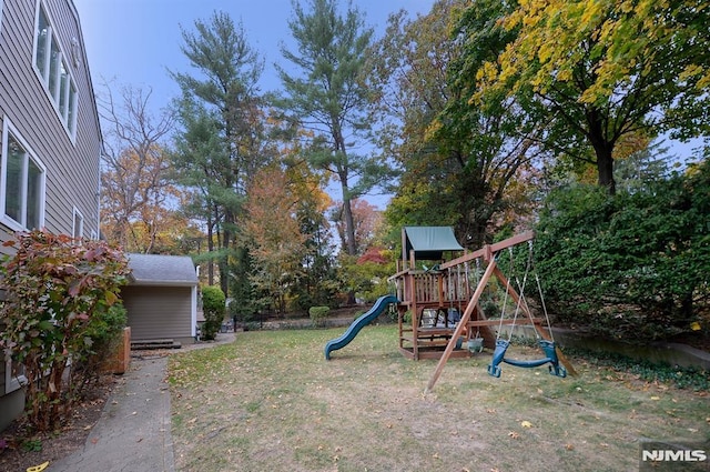 view of jungle gym featuring a lawn