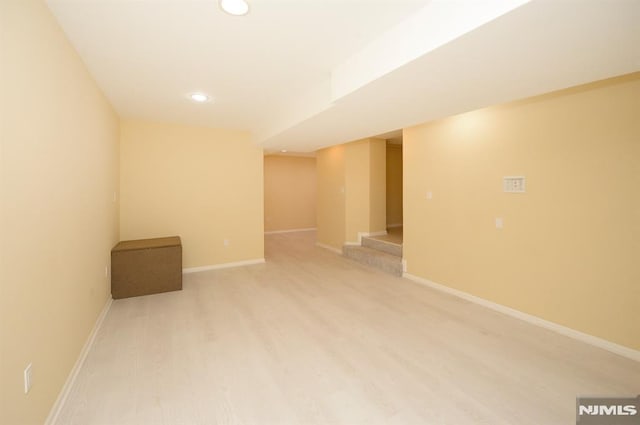 basement featuring hardwood / wood-style flooring