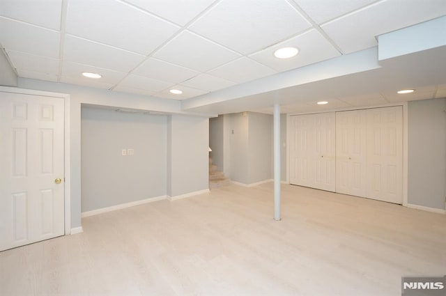 basement featuring a drop ceiling