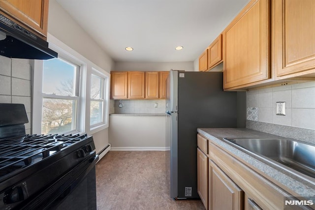 kitchen featuring ventilation hood, light brown cabinets, black stove, and baseboard heating