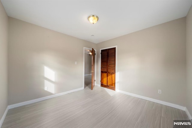 spare room with light hardwood / wood-style flooring