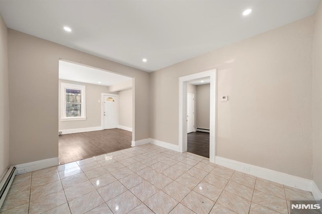 empty room with a baseboard heating unit