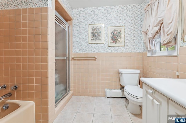 full bathroom featuring separate shower and tub, a baseboard heating unit, tile walls, and tile patterned floors