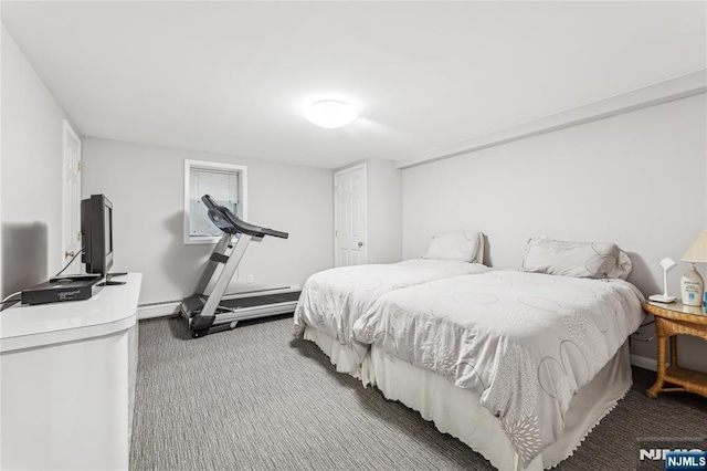 bedroom featuring a baseboard radiator and carpet floors