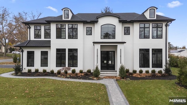 view of front of home featuring a front yard and french doors