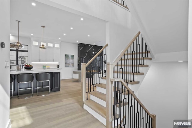 stairway featuring hardwood / wood-style floors