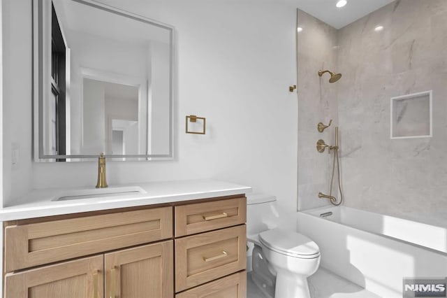 full bathroom with toilet, vanity, and tiled shower / bath combo