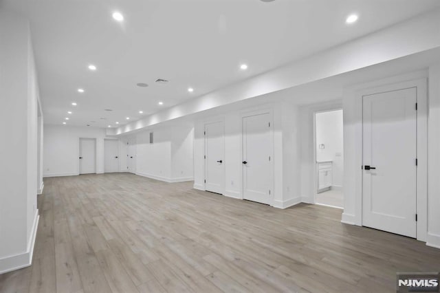 basement featuring light wood-type flooring