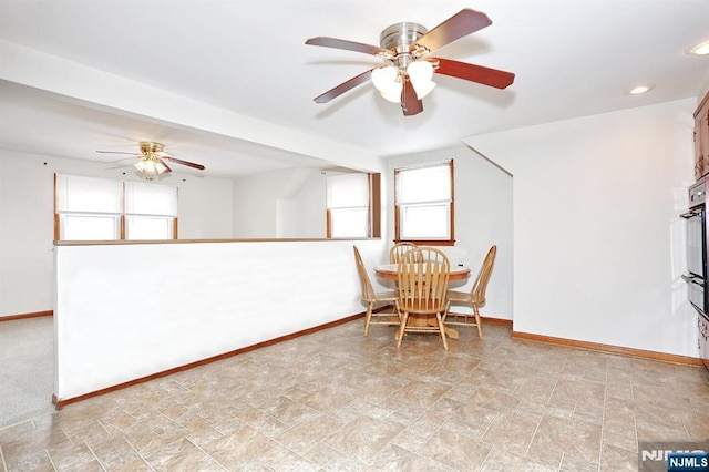 unfurnished dining area with ceiling fan