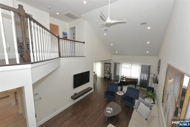 living room with a ceiling fan, high vaulted ceiling, dark wood-type flooring, and recessed lighting