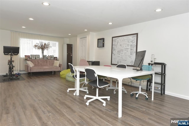 office featuring baseboards, wood finished floors, and recessed lighting