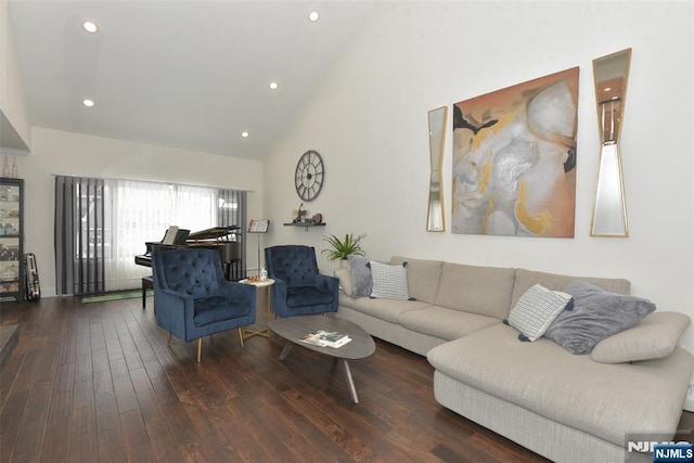 living area with high vaulted ceiling, dark wood finished floors, and recessed lighting