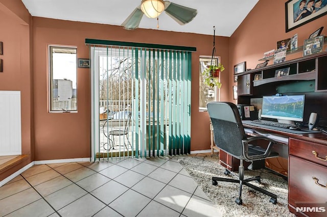 office area with ceiling fan, light tile patterned flooring, and vaulted ceiling