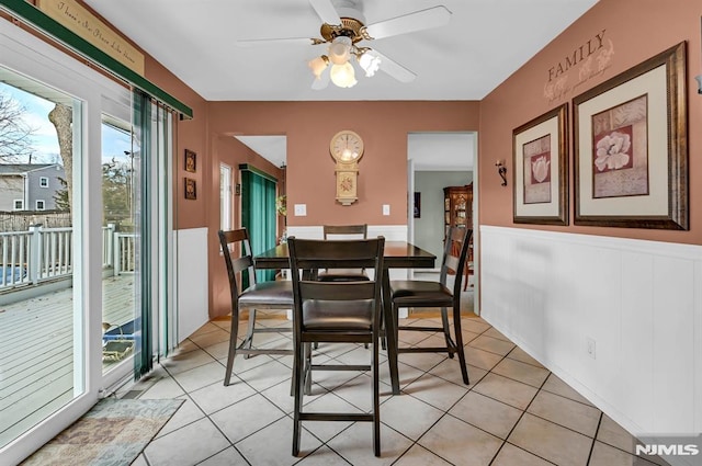 dining area featuring light tile patterned flooring, a wealth of natural light, and ceiling fan