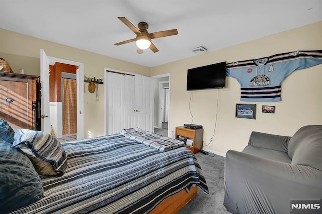 carpeted bedroom with a closet and ceiling fan