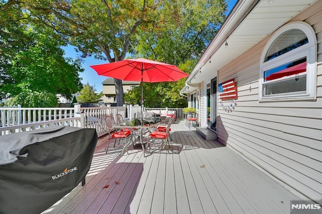 wooden terrace with area for grilling