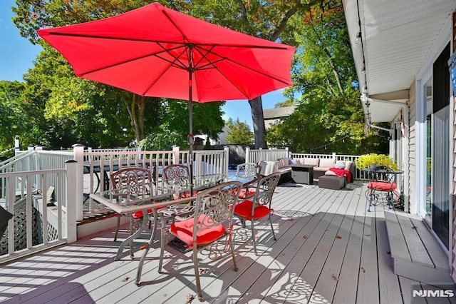 wooden deck with an outdoor hangout area