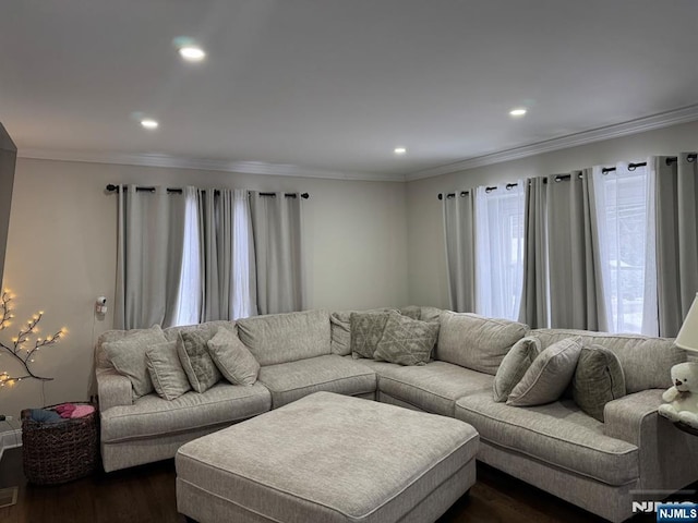 living room with ornamental molding and dark hardwood / wood-style flooring