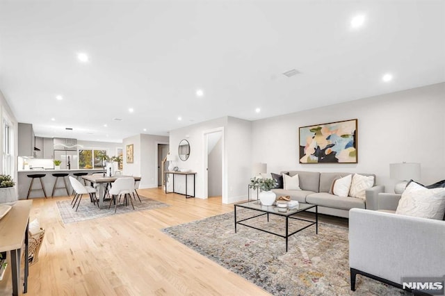 living room with light hardwood / wood-style floors