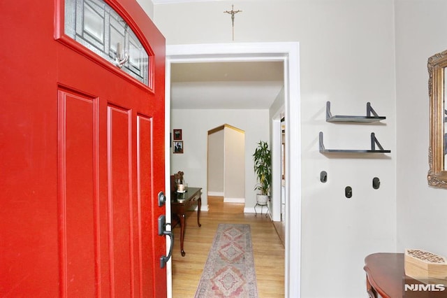 foyer entrance with light wood-type flooring