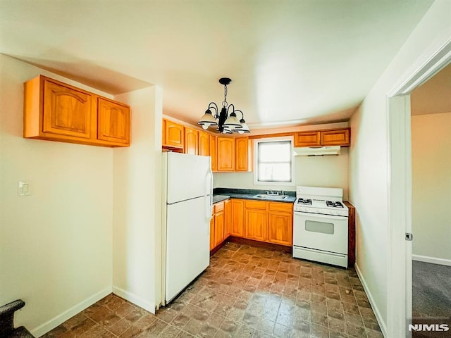 kitchen featuring a chandelier, white appliances, decorative light fixtures, and sink