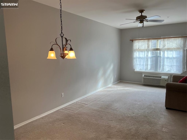 interior space with carpet, ceiling fan with notable chandelier, and a wall mounted AC