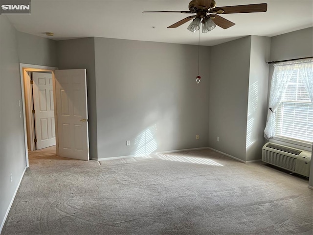 unfurnished room with ceiling fan, cooling unit, and light carpet