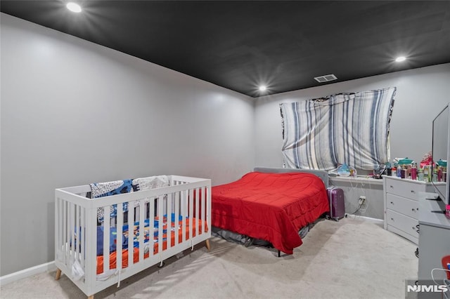 bedroom featuring light colored carpet