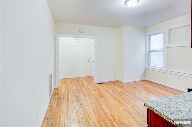 empty room featuring light hardwood / wood-style floors