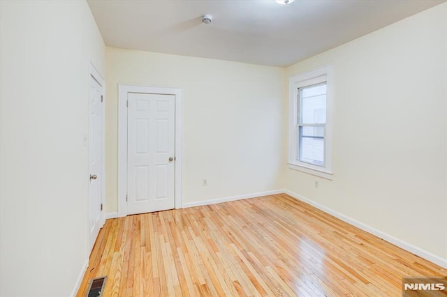 empty room featuring light hardwood / wood-style floors