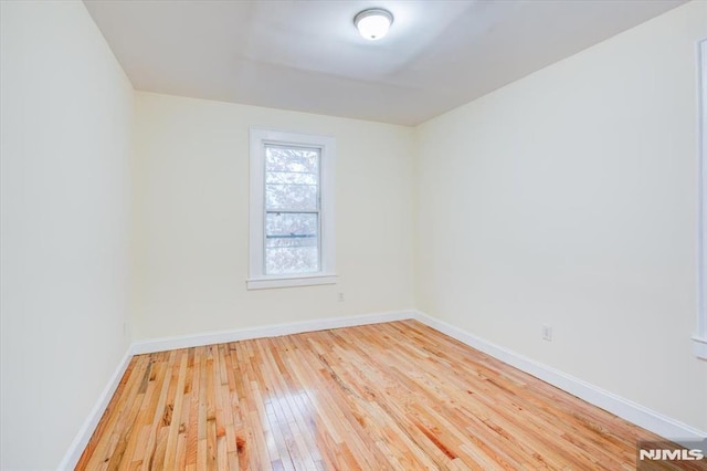 empty room featuring hardwood / wood-style flooring