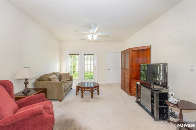 living room with light carpet and ceiling fan