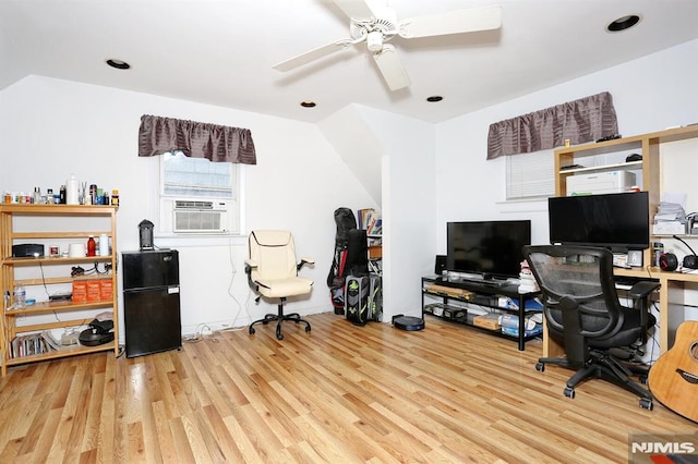 office area featuring ceiling fan, cooling unit, and light hardwood / wood-style floors