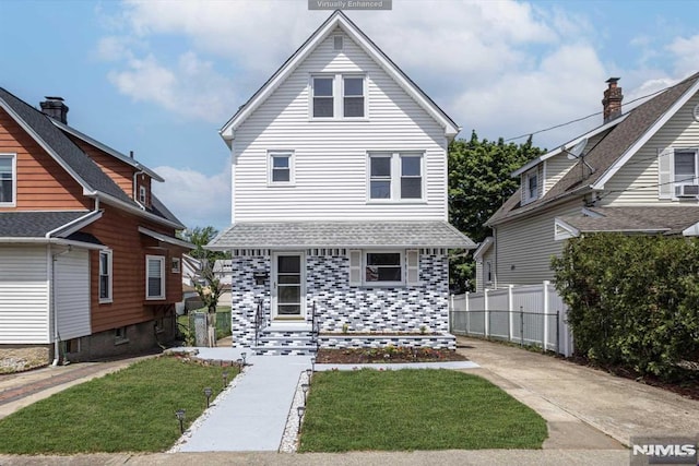 view of property with a front lawn