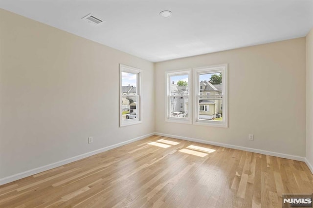 empty room with light wood-type flooring