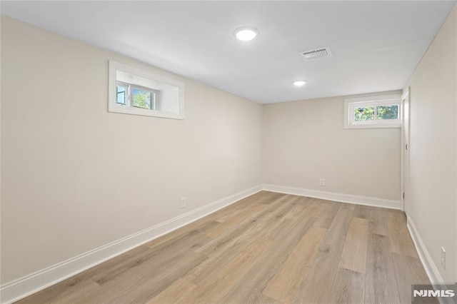 basement featuring light hardwood / wood-style floors