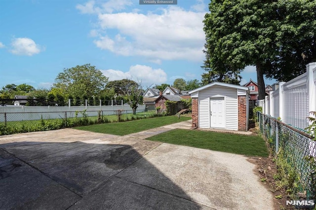 view of yard with a patio area and a shed