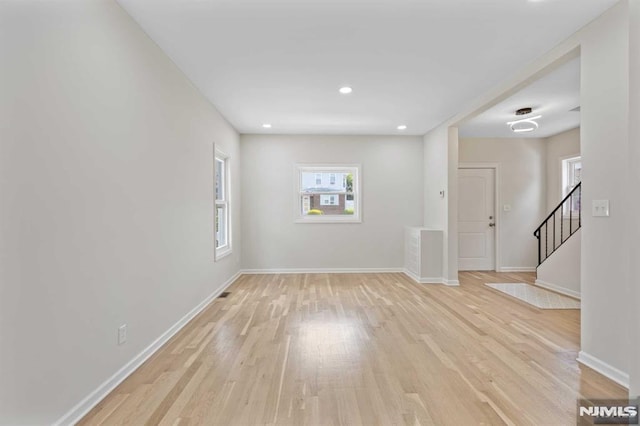 unfurnished room featuring light wood-type flooring