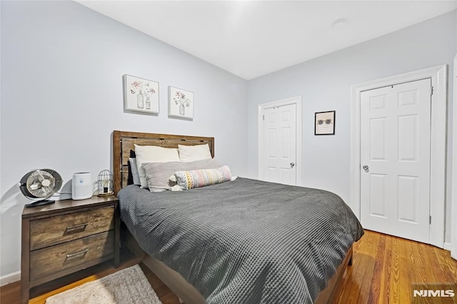 bedroom featuring hardwood / wood-style floors